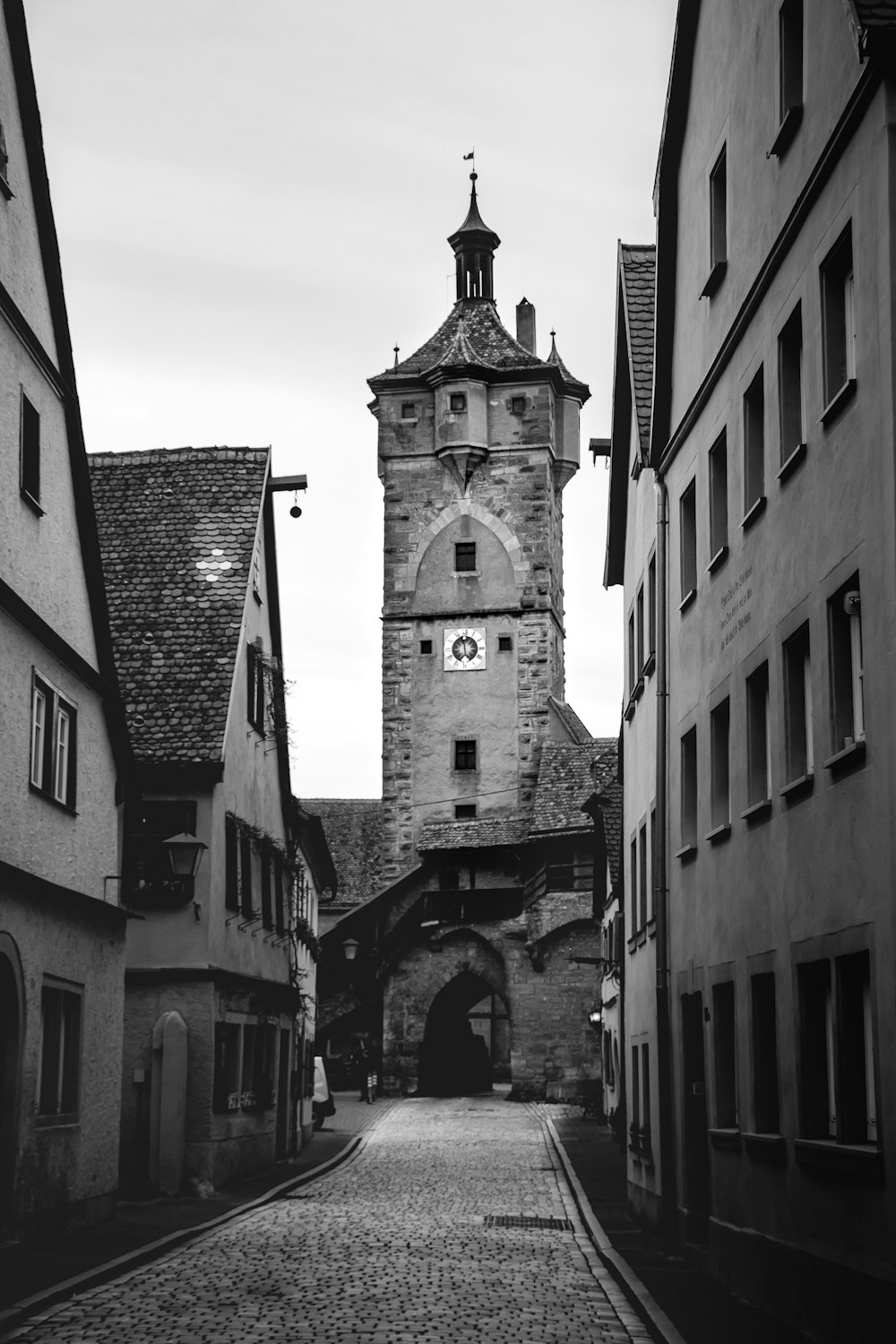 a black and white photo of a clock tower