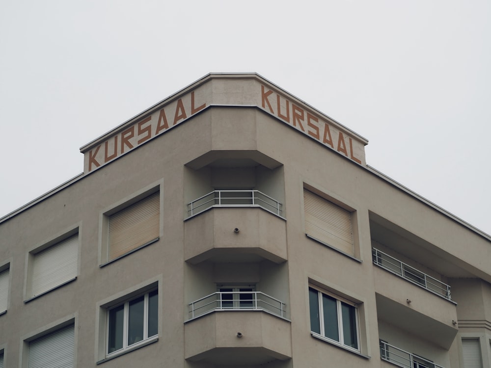 a tall building with balconies and balconies on the top of it