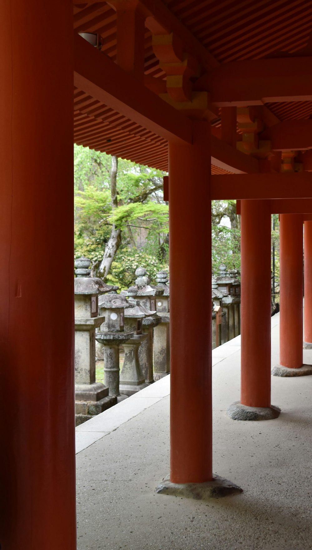 a red building with columns in the middle of it