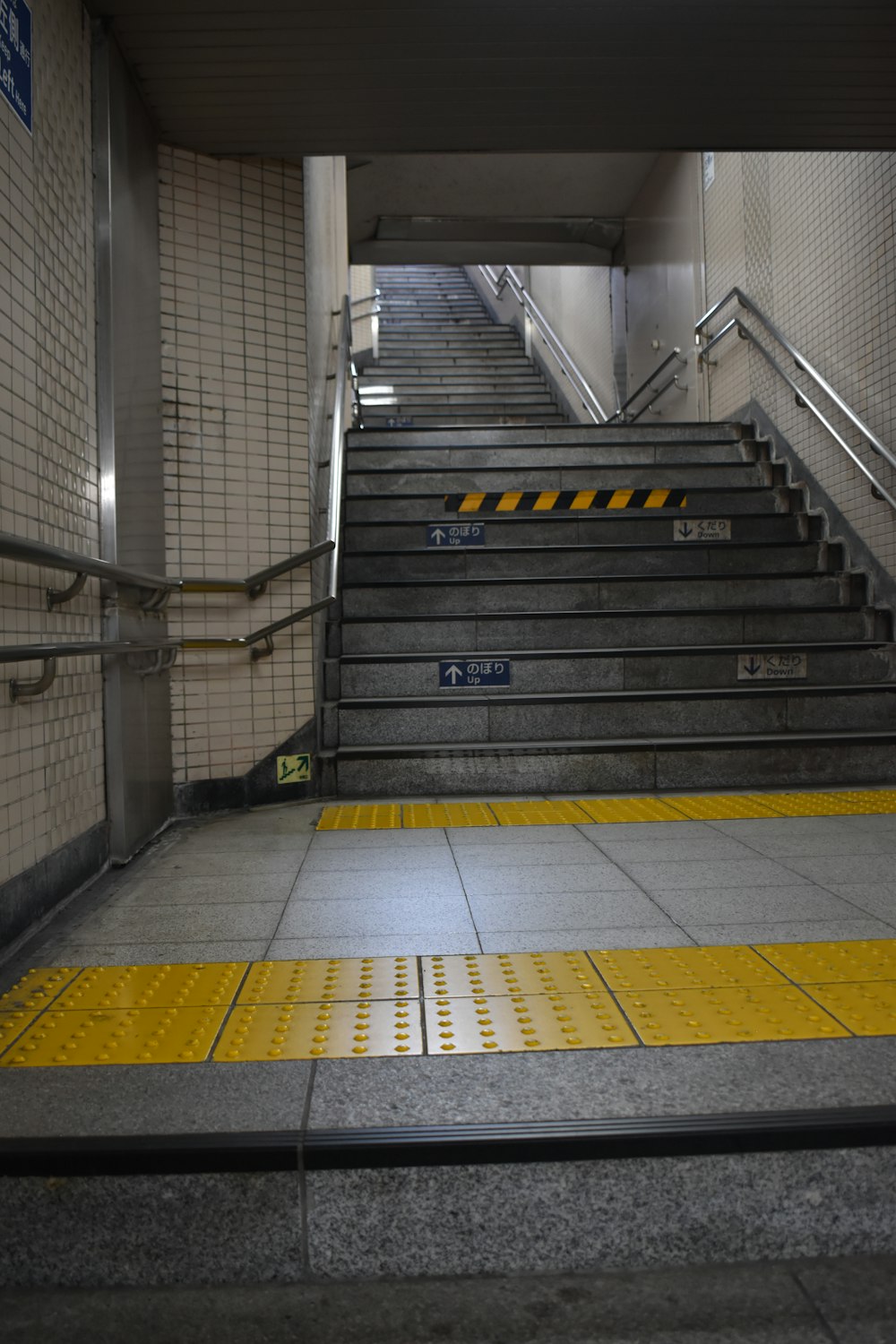 a set of stairs leading up to a subway station
