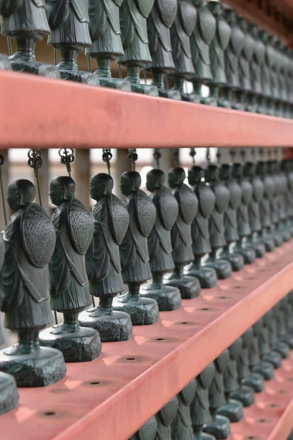 a shelf filled with lots of little figurines