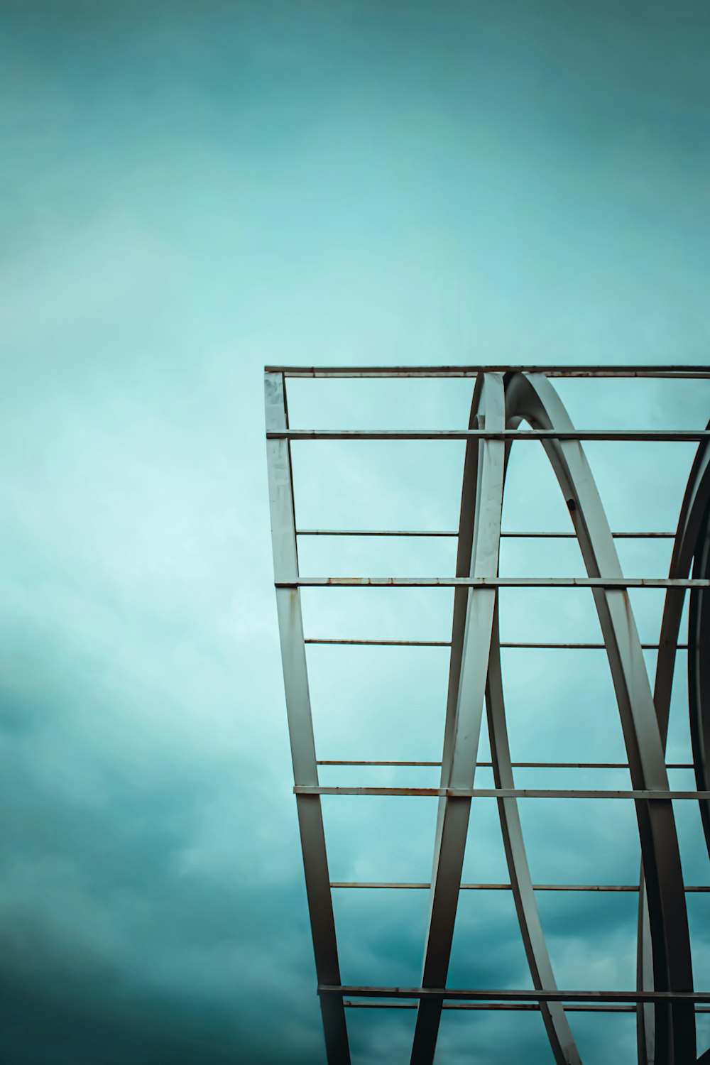 a tall metal structure with a sky in the background