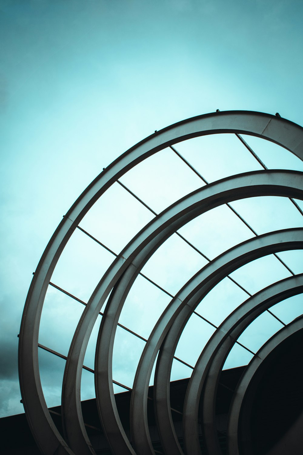 a close up of a building with a sky in the background