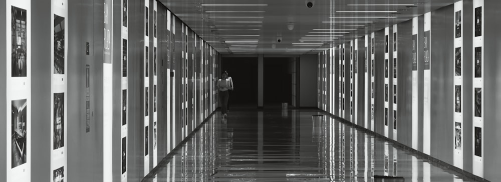 a long hallway with a lot of pictures on the wall