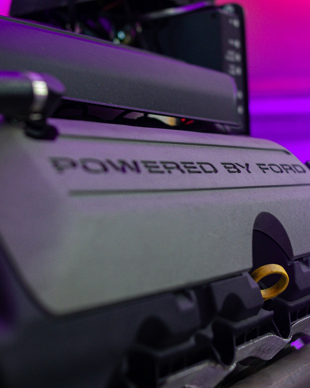 a close up of a machine with a purple background