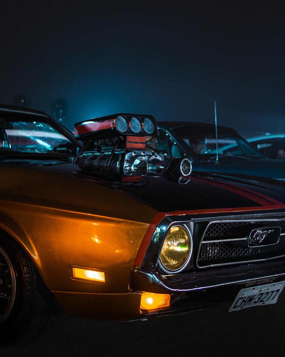 a car parked in a parking lot at night