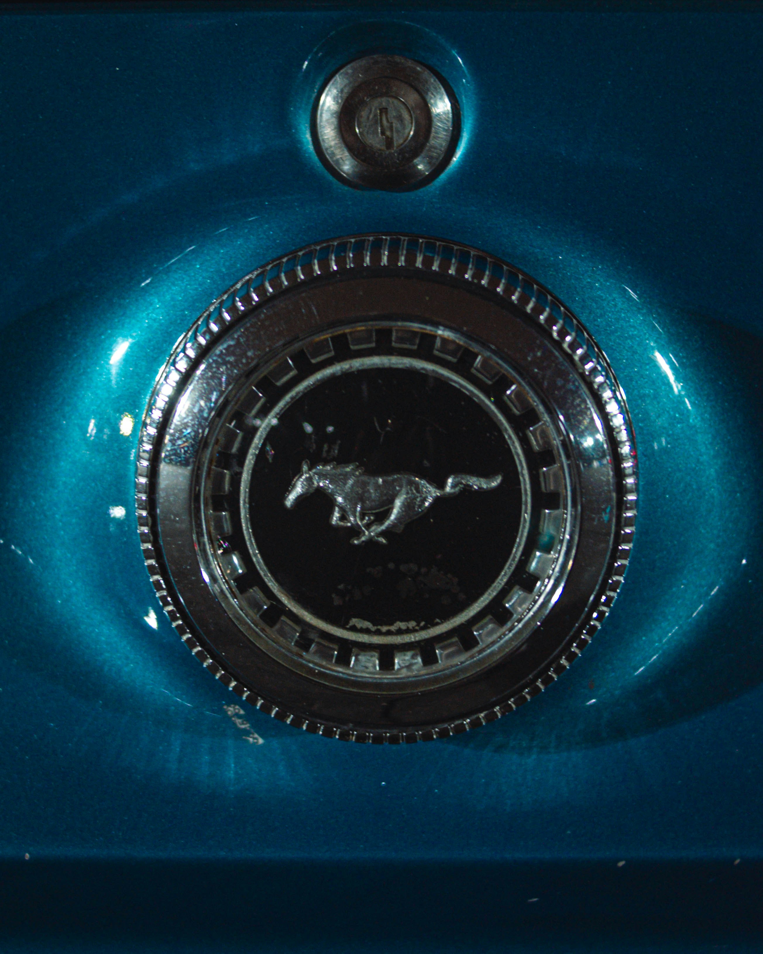 a close up of the front of a blue car