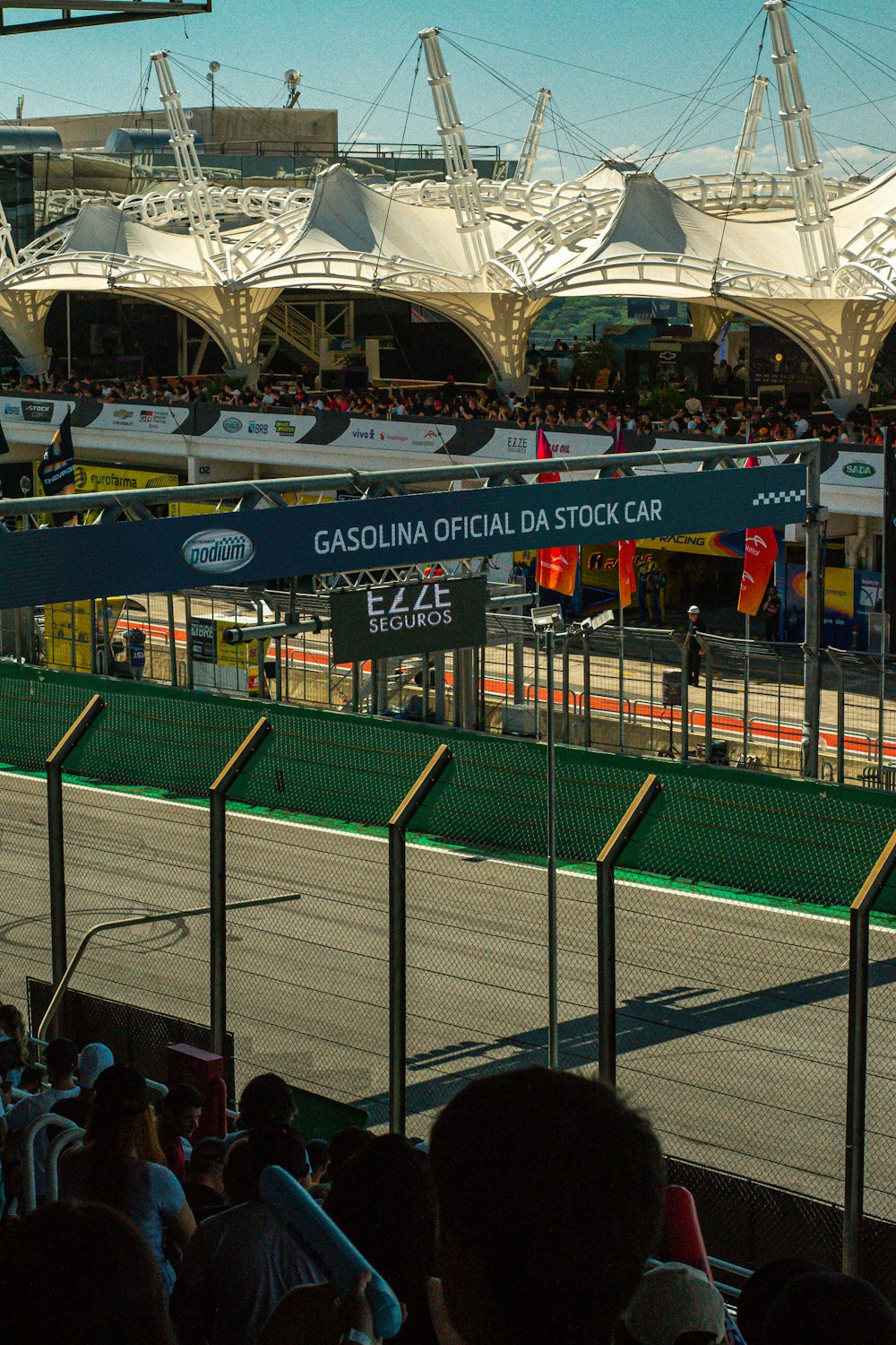 a crowd of people watching a race on a track