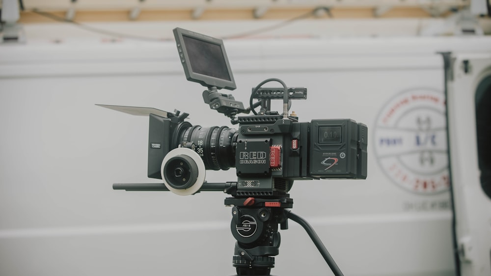 a video camera with a laptop on a tripod