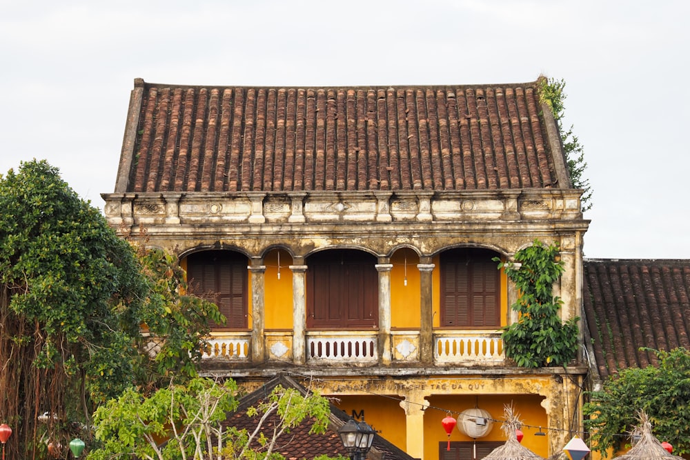 an old building with a clock on the front of it