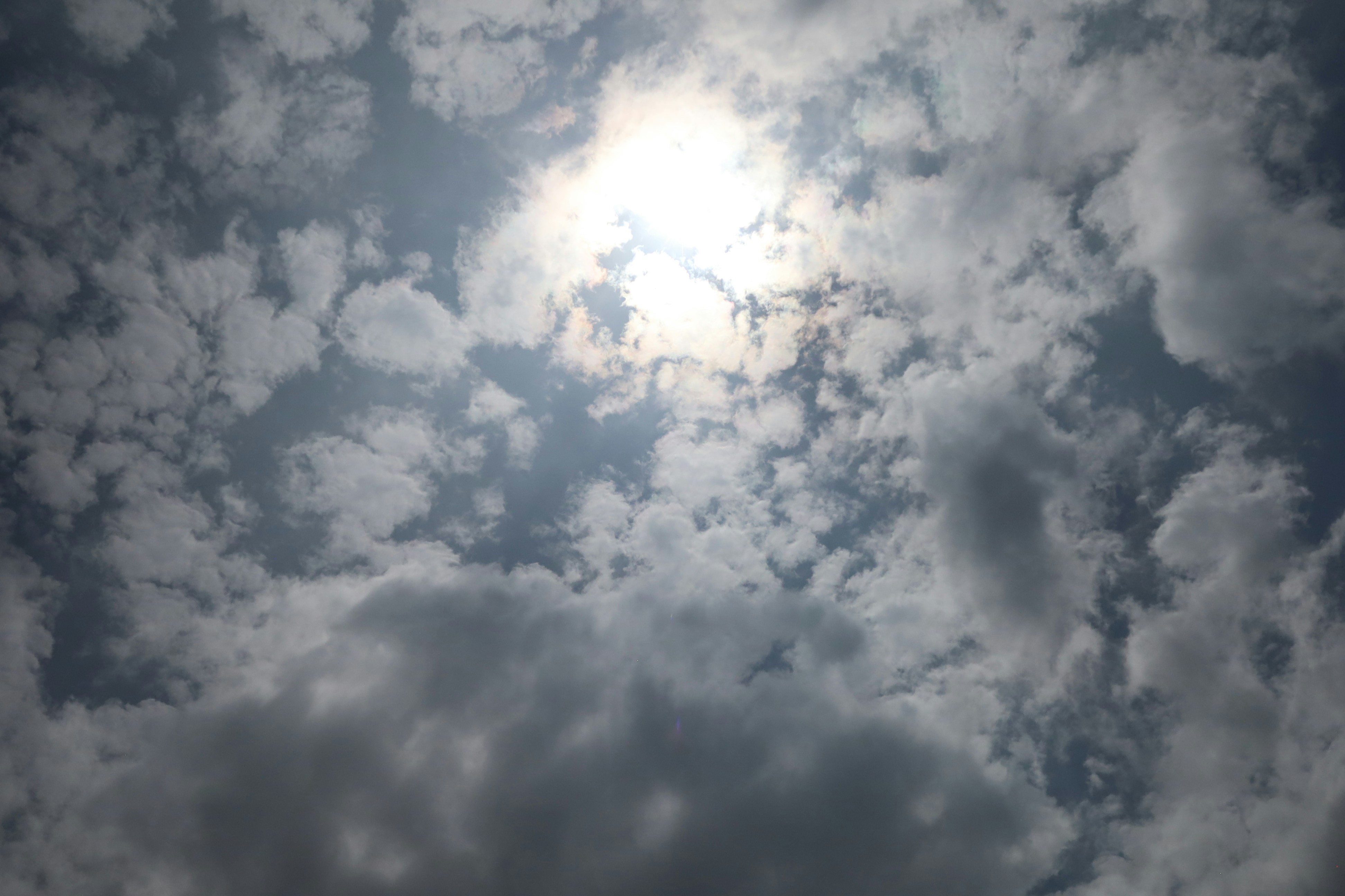 the sun is shining through the clouds in the sky