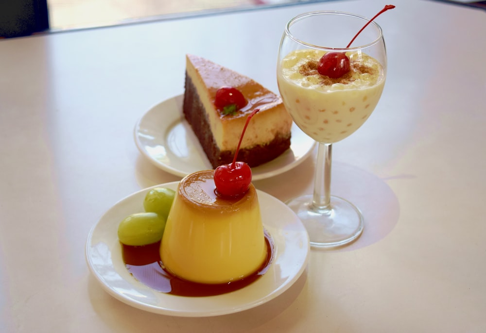 a table topped with two desserts and a drink