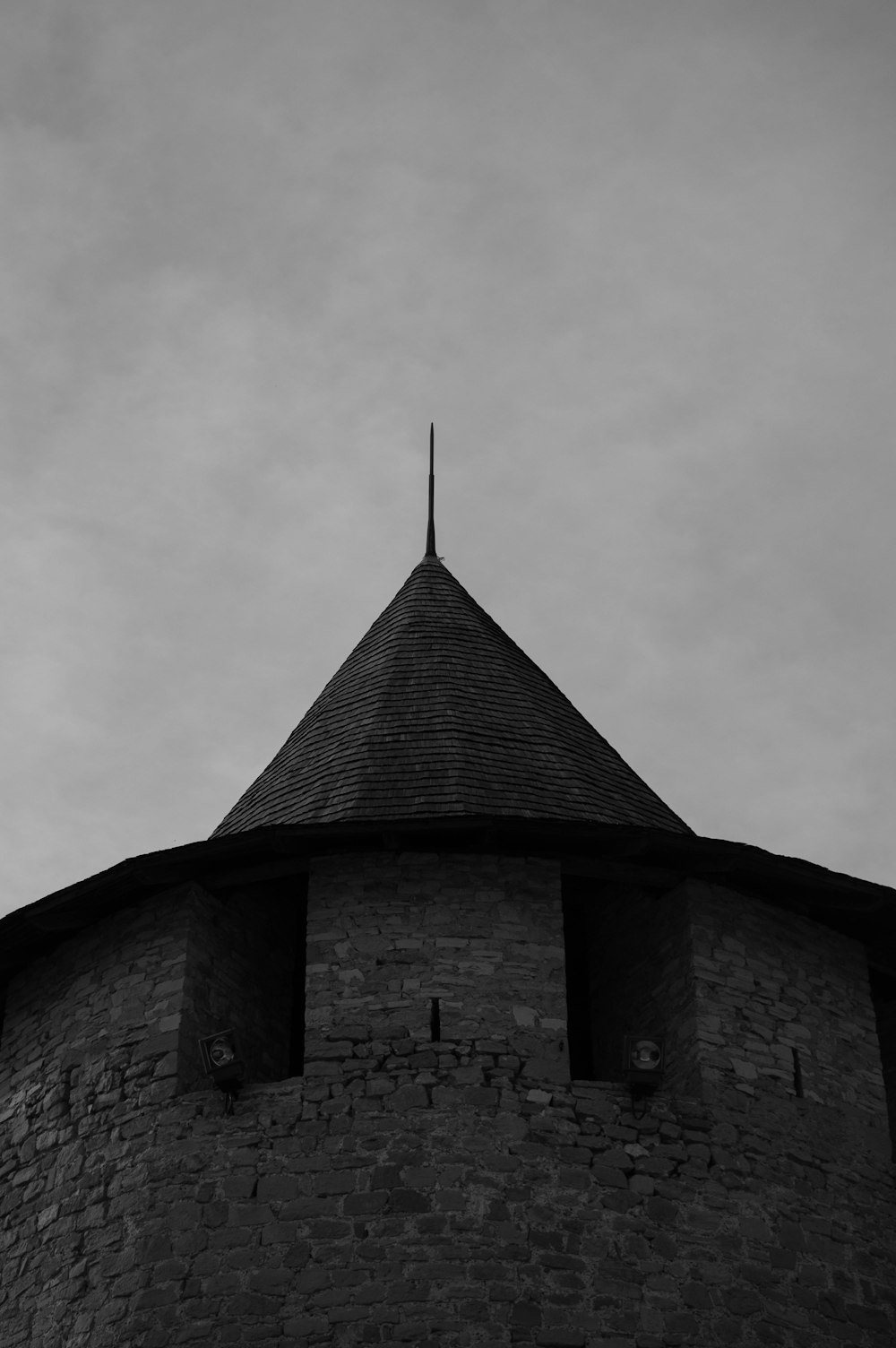 a black and white photo of a tower