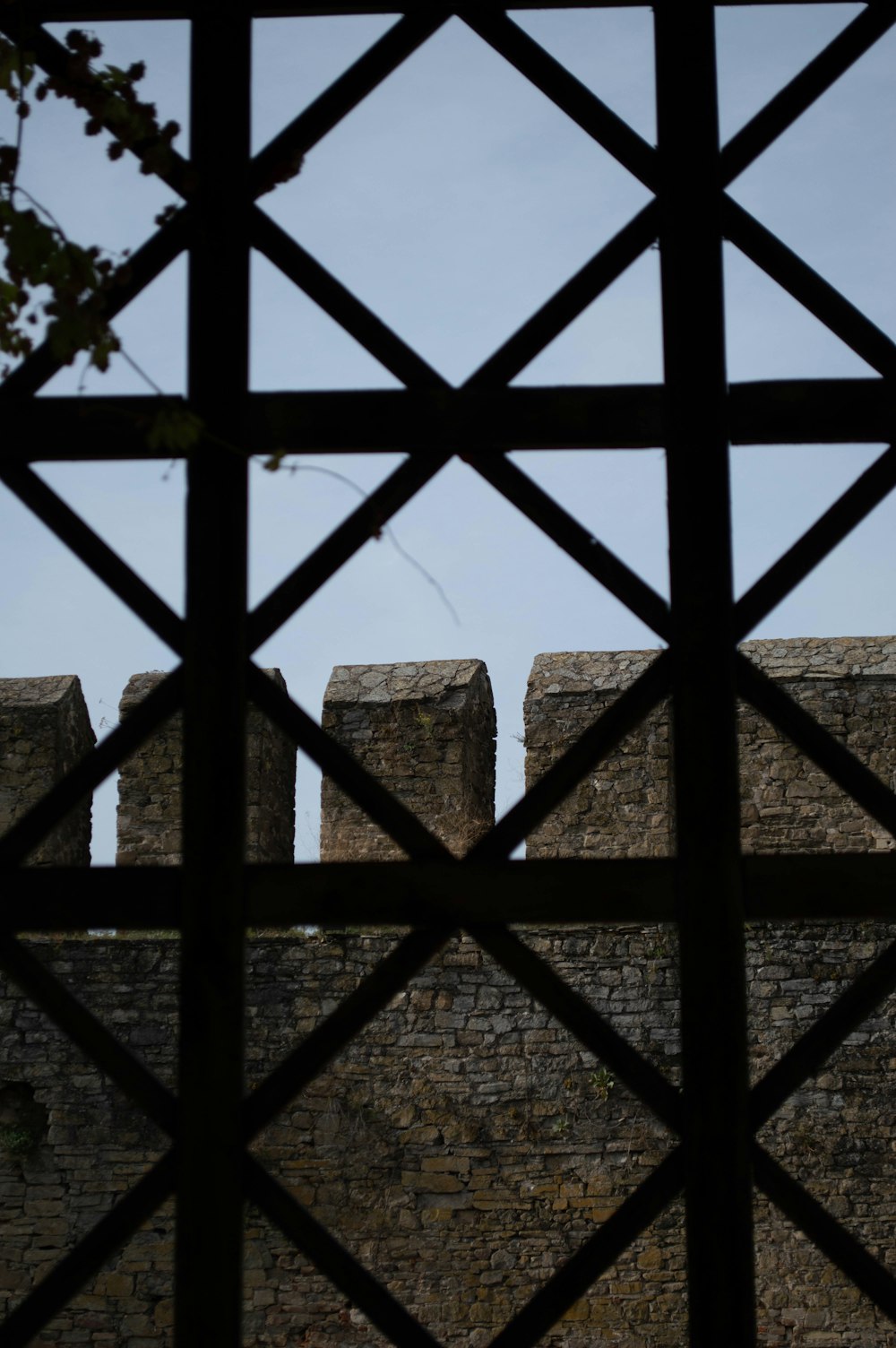 a view of a stone wall through a window