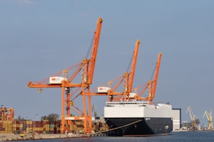 a large cargo ship docked at a dock