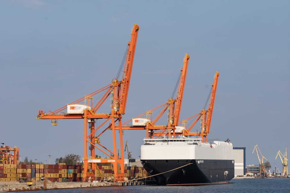 a large cargo ship docked at a dock