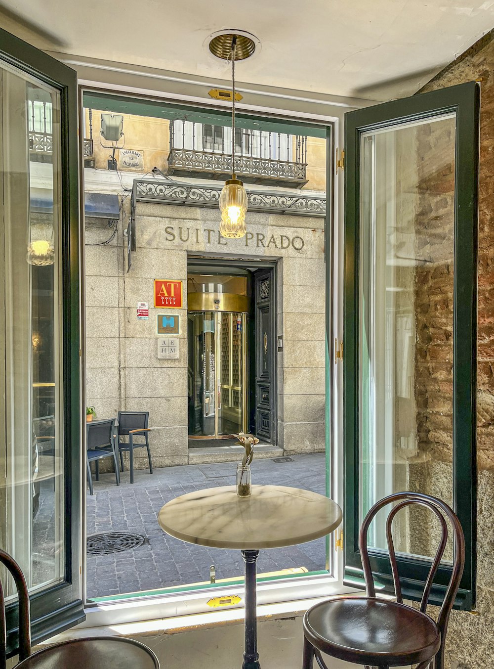 two chairs and a table in front of a window