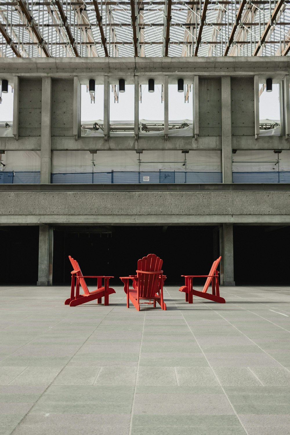 a couple of red chairs sitting next to each other