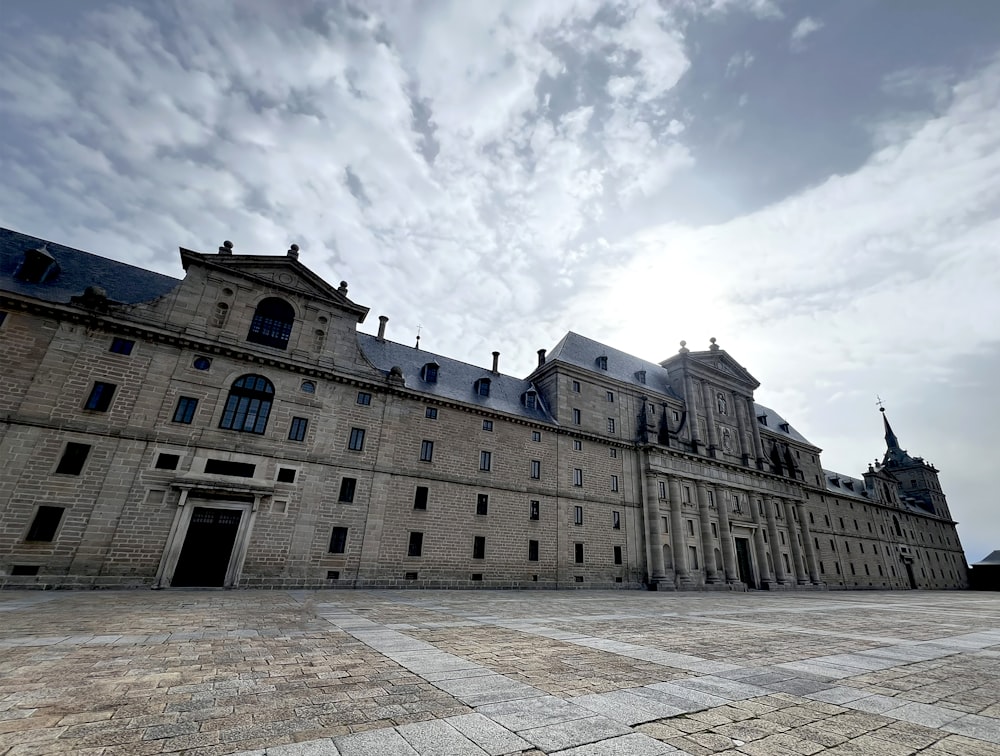 a large stone building with a sky background