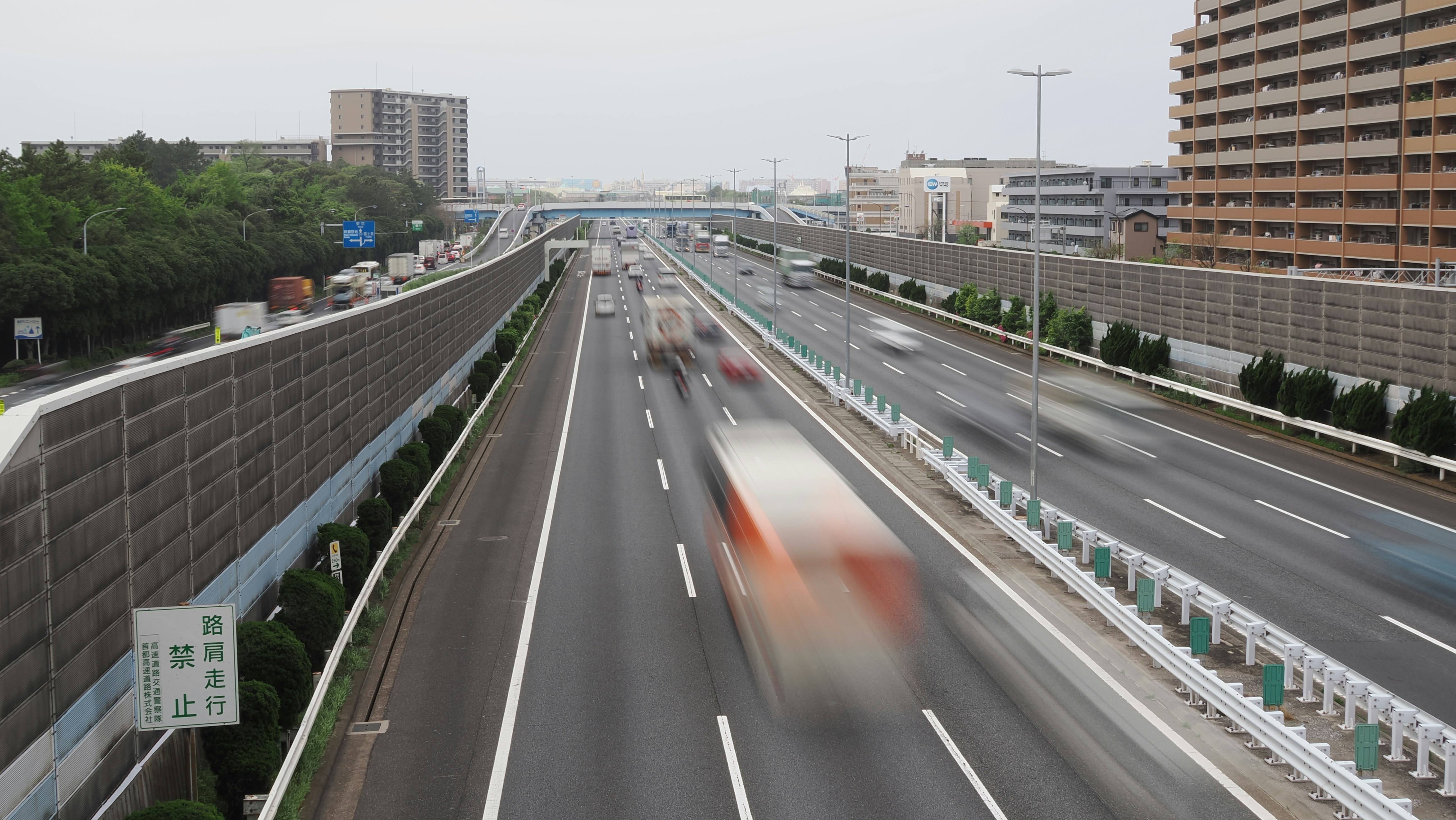 a blurry photo of a highway with cars on it