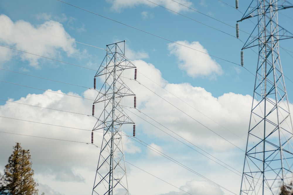 a group of power lines against a cloudy blue sky