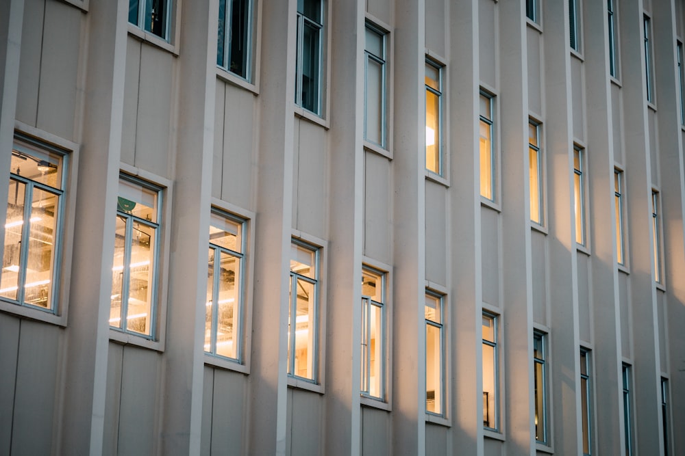 a building that has many windows and lights in it