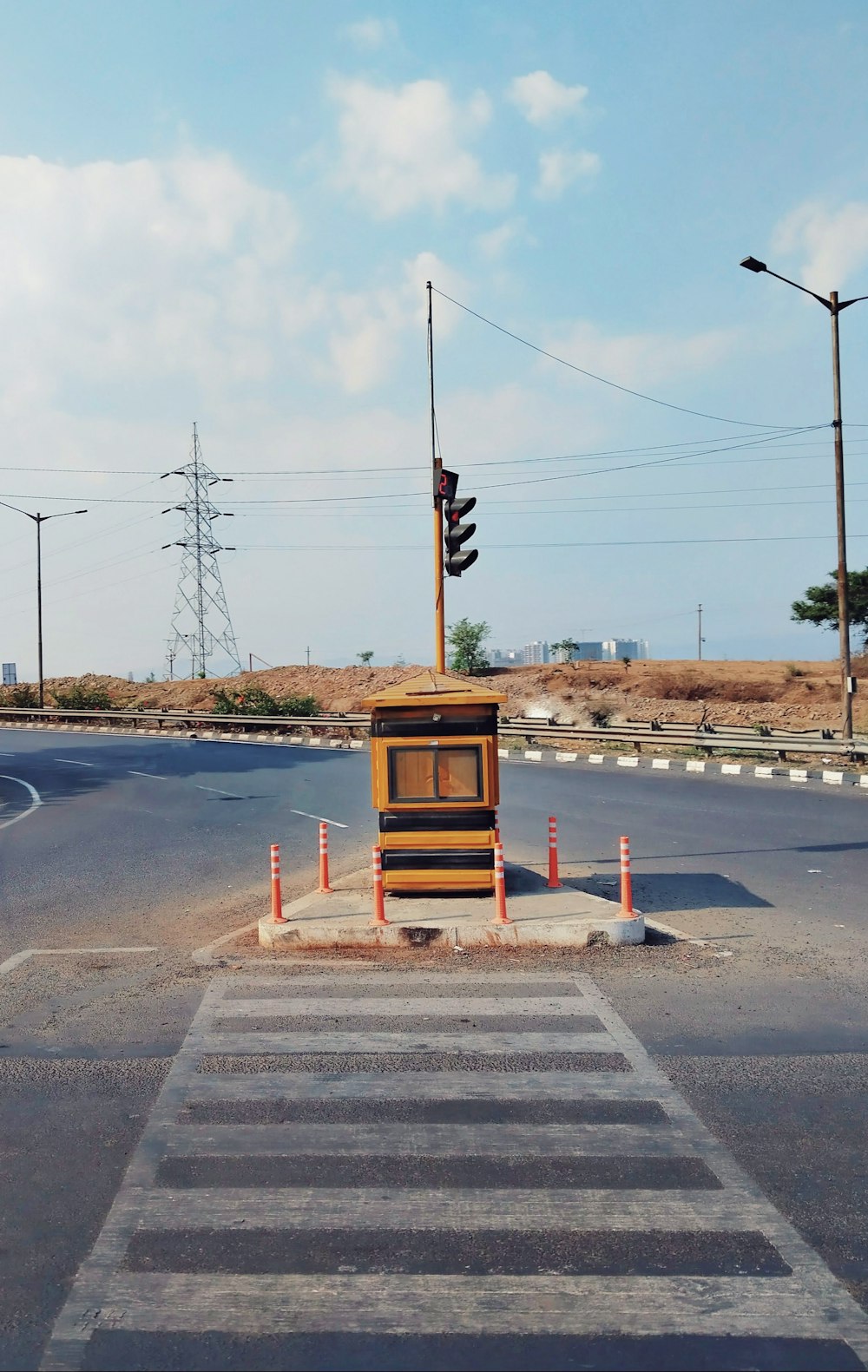 a traffic light sitting on the side of a road