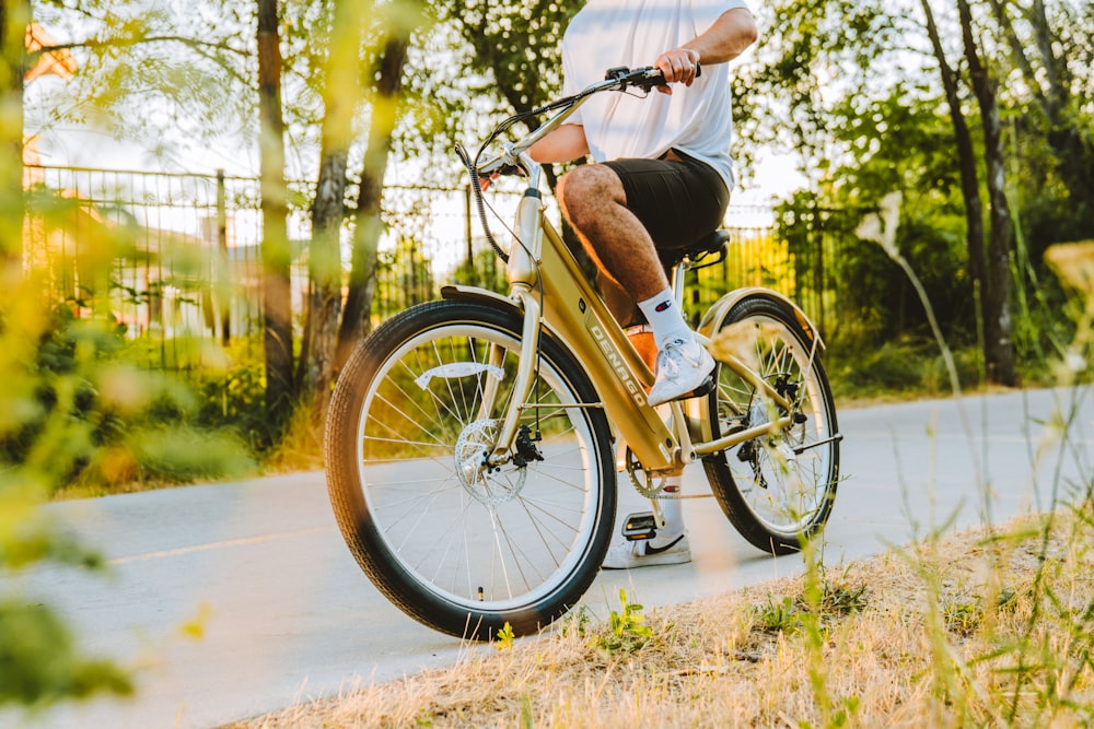 a man riding a bike down a street