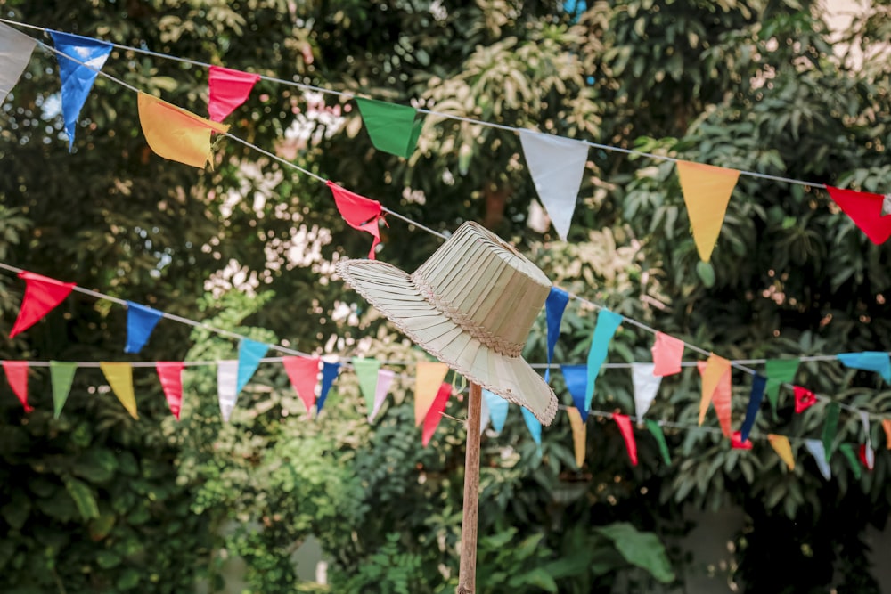 a hat is hanging on a clothes line