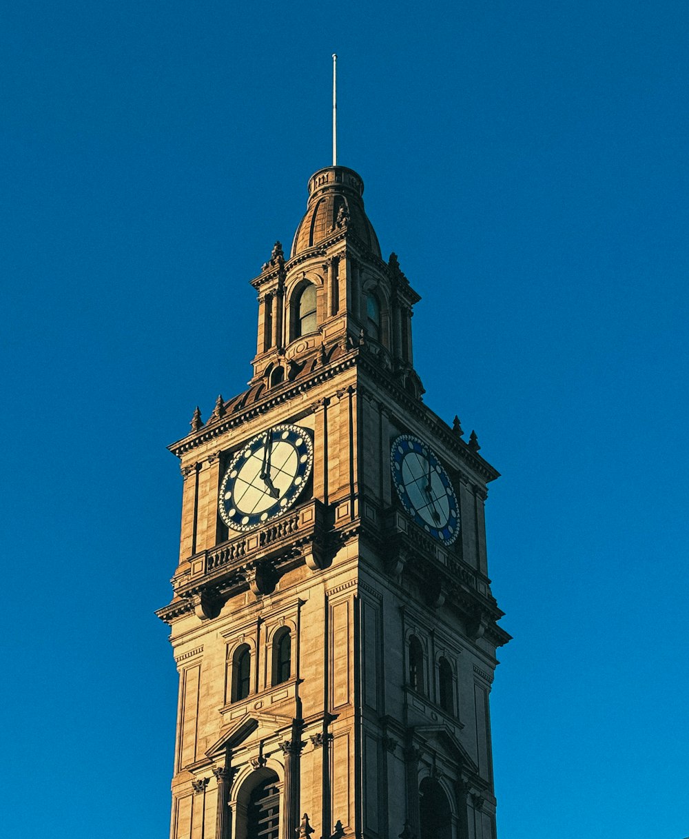 a tall clock tower with a sky background