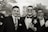 a group of men in suits posing for a picture