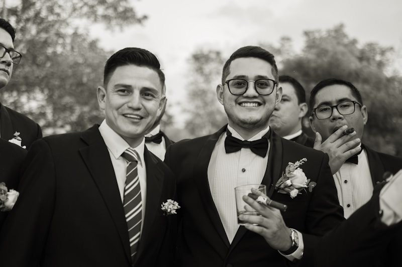 a group of men in suits posing for a picture