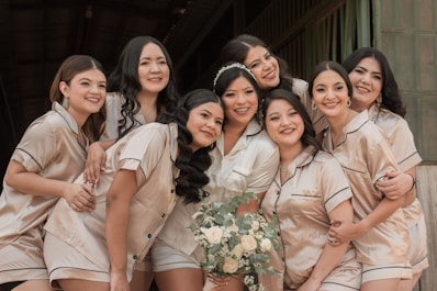 a group of women standing next to each other