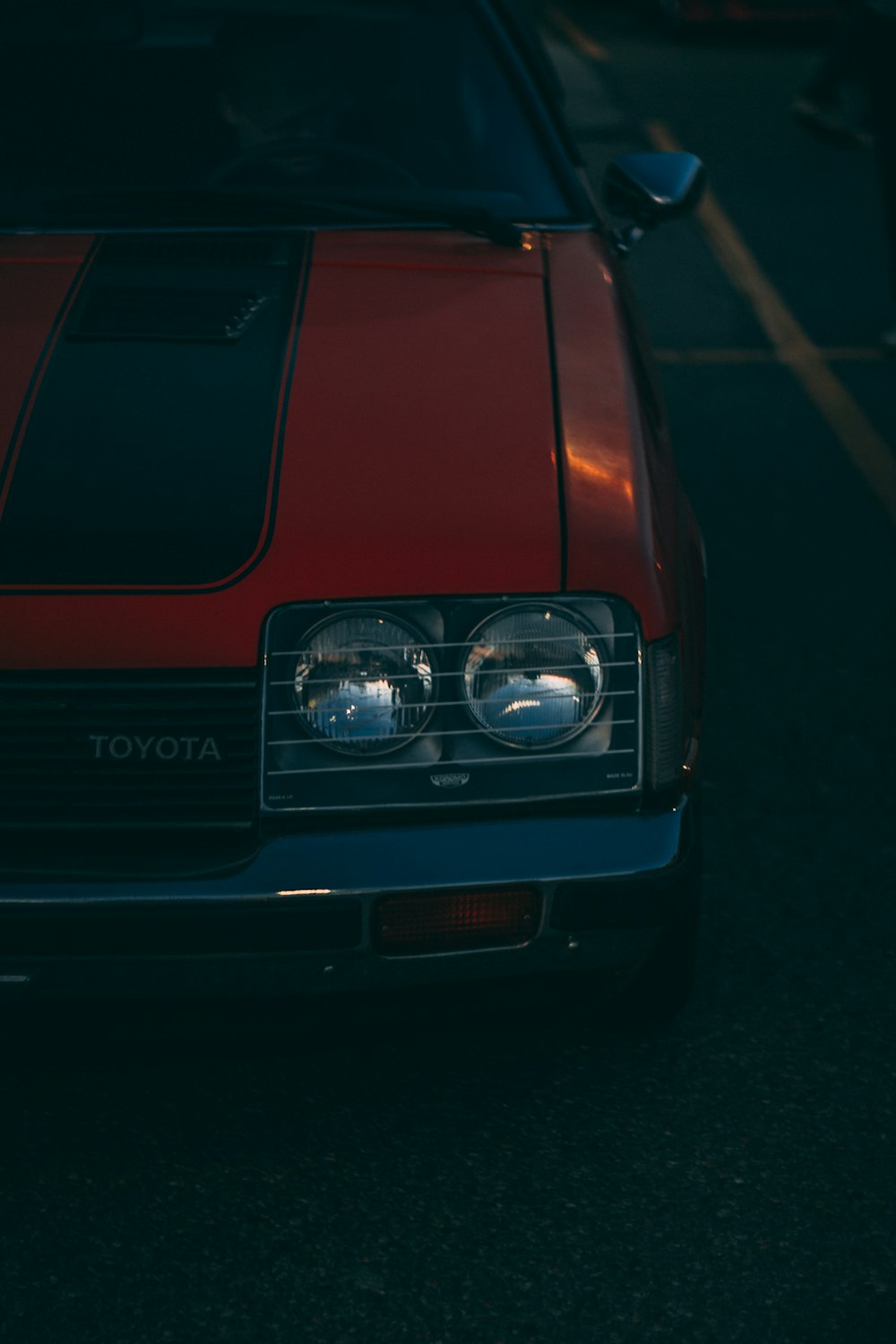 a red car parked in a parking lot