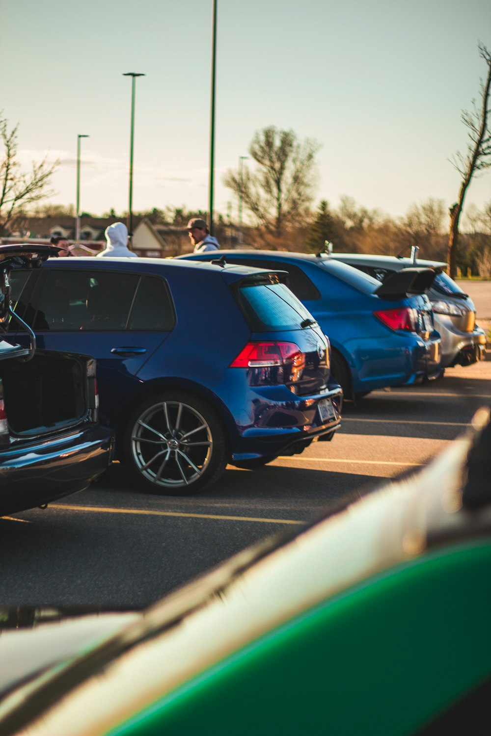 a group of cars parked in a parking lot