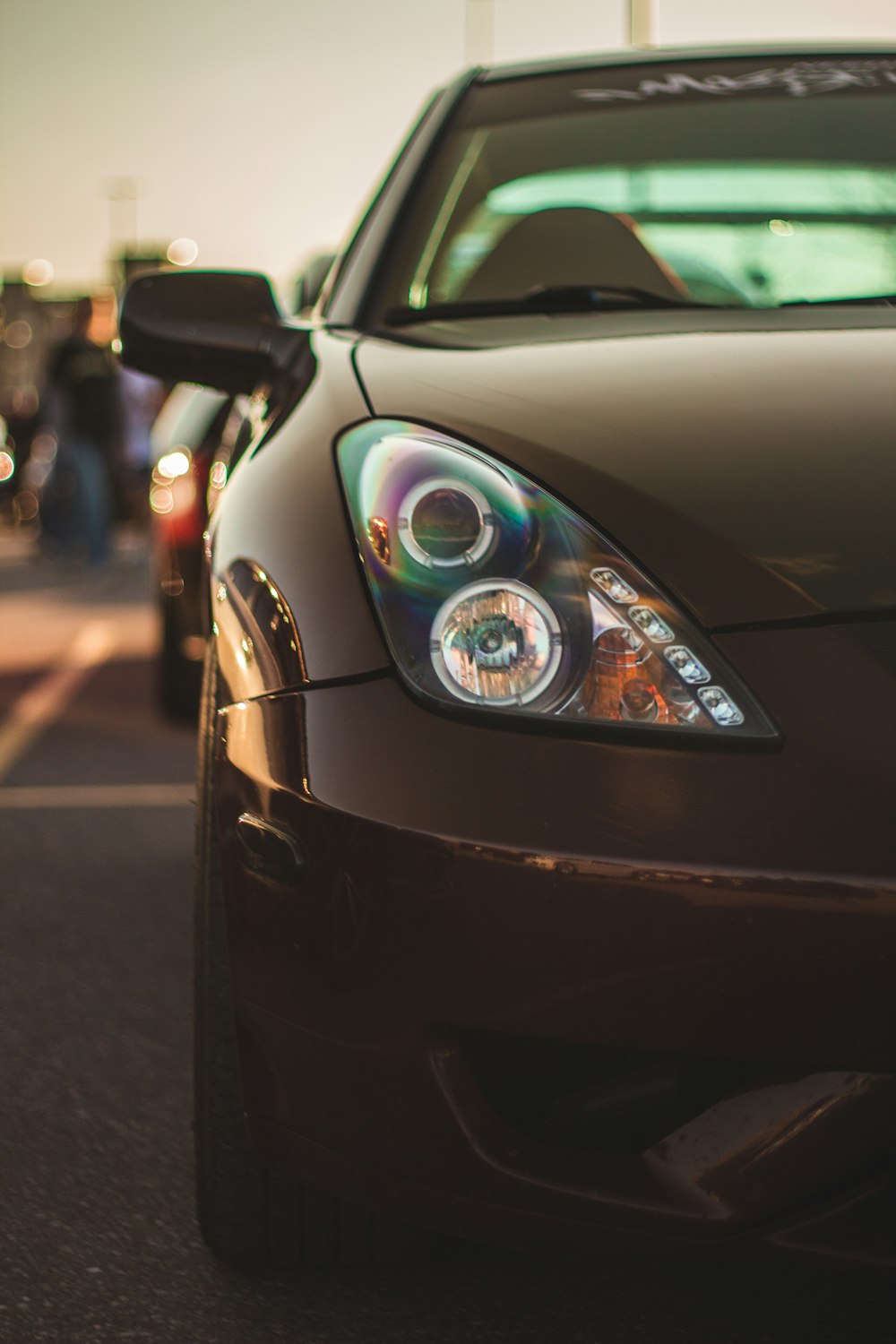 a close up of a car parked on the side of the road