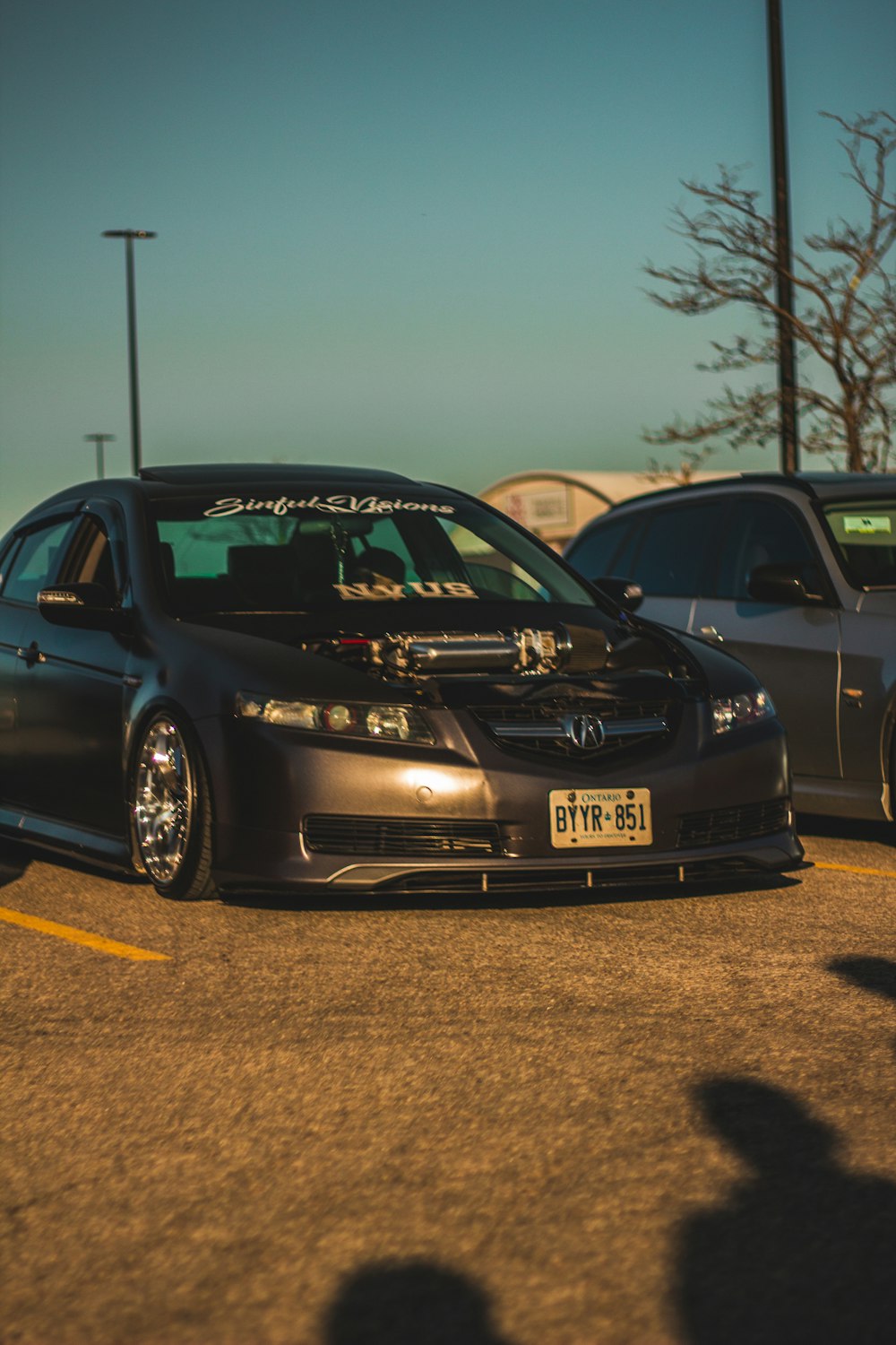 a couple of cars parked in a parking lot