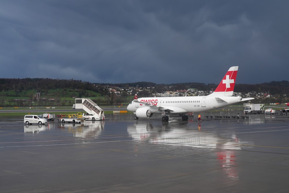 a large passenger jet sitting on top of an airport tarmac