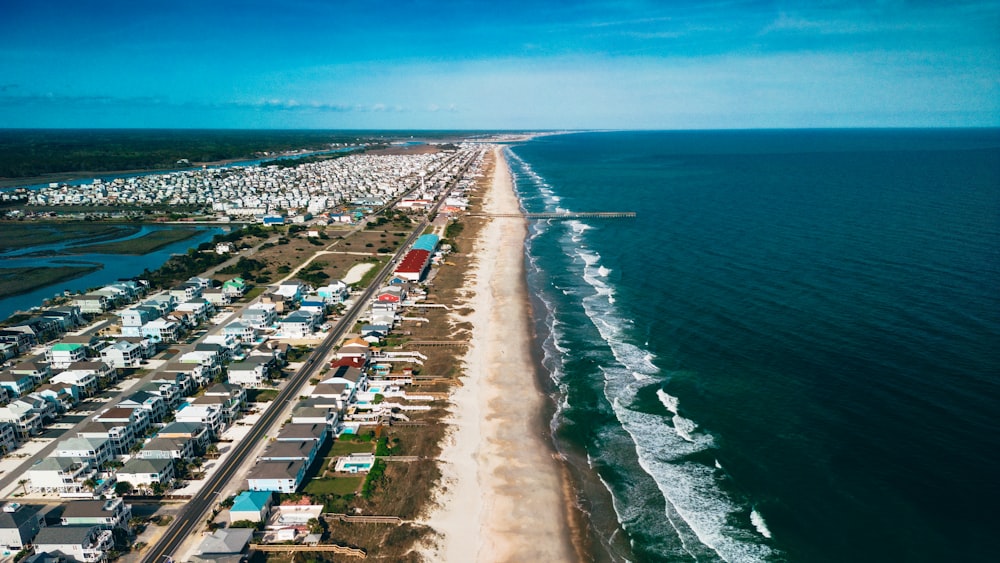 an aerial view of a beach and a city