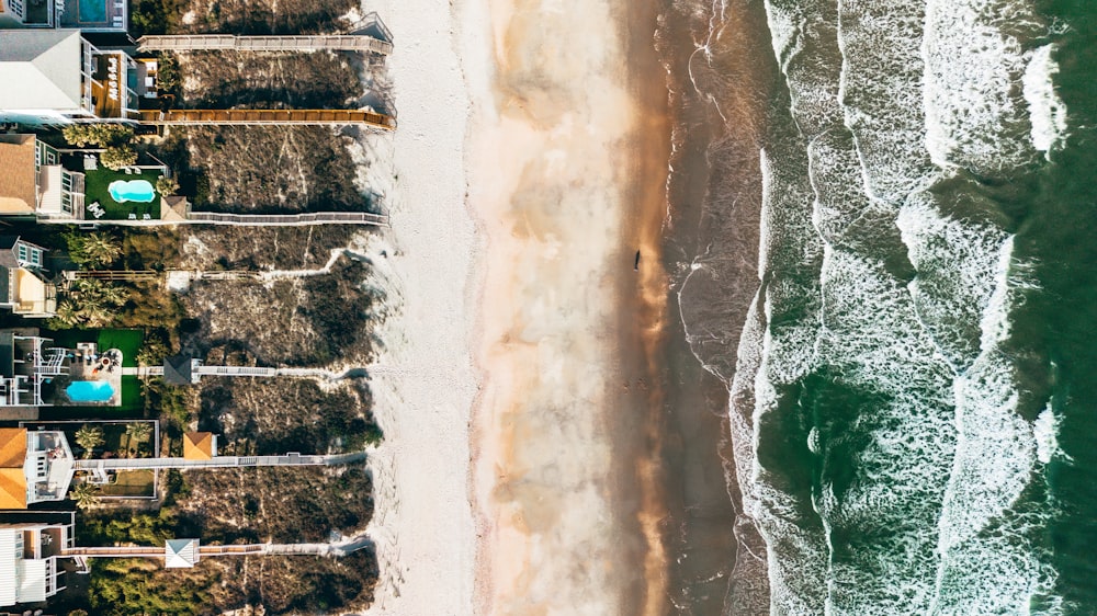 an aerial view of a beach and houses