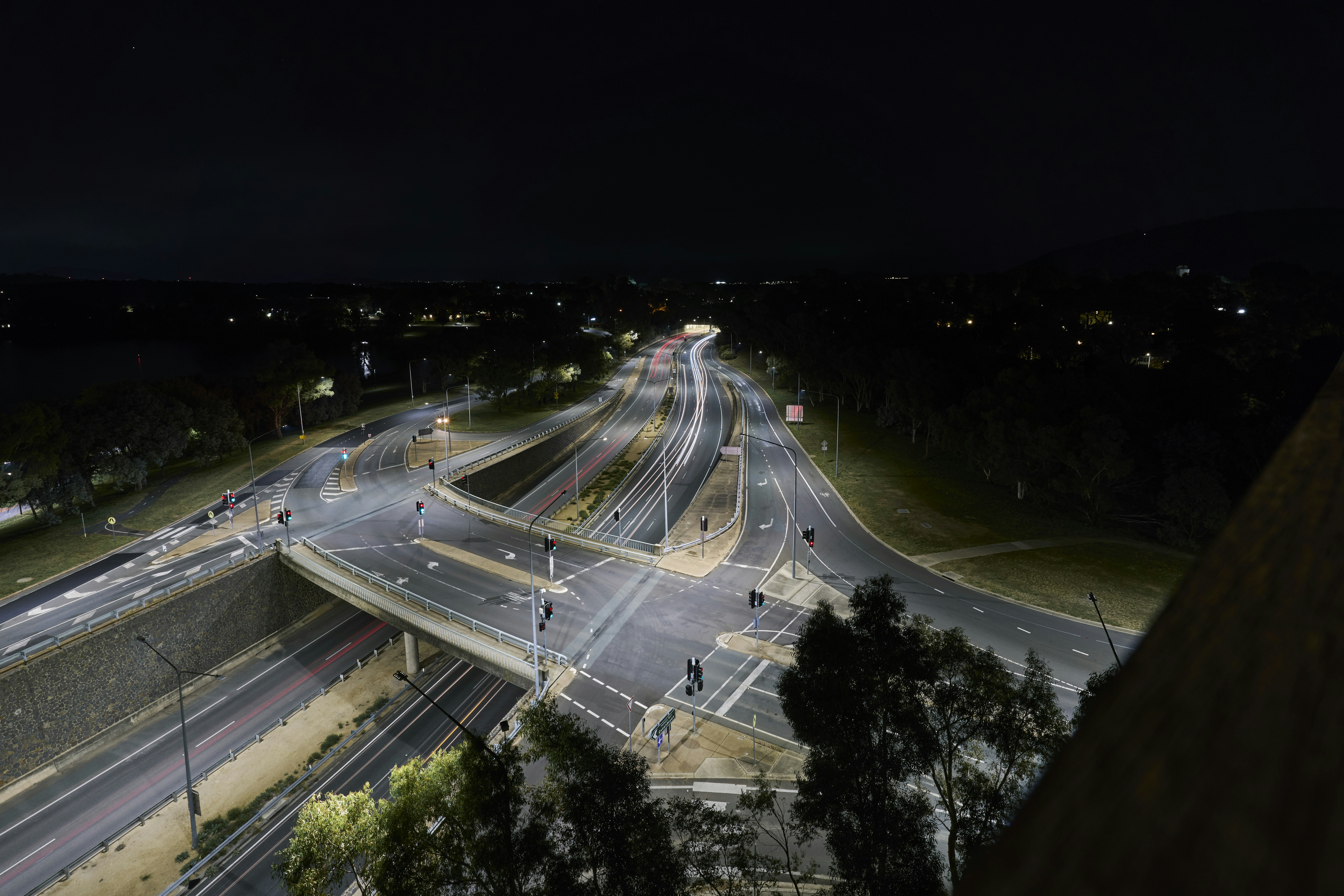 A night time view of a highway intersection