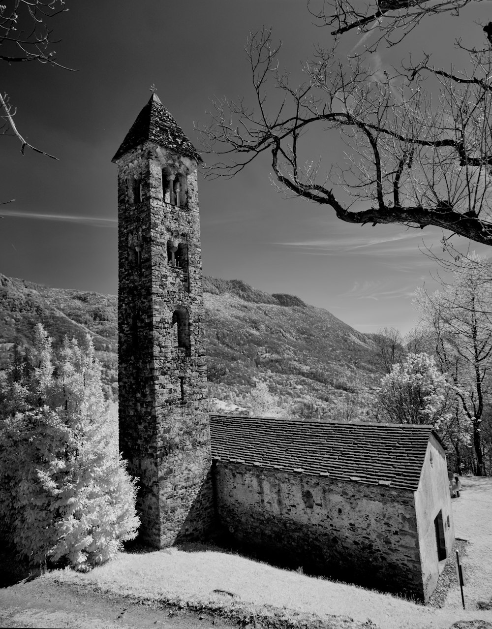 a black and white photo of a church tower