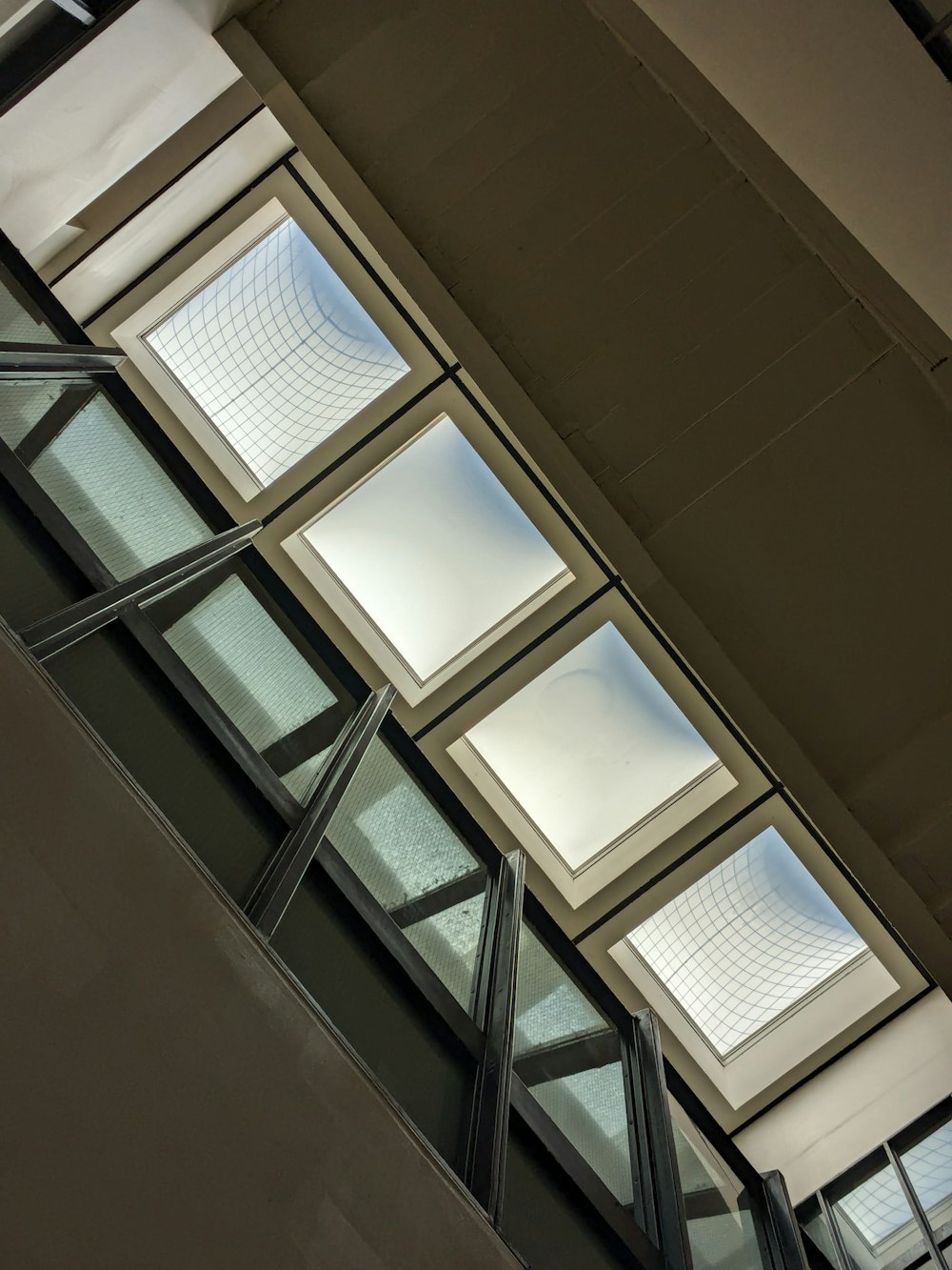 the ceiling of a building with a skylight above it