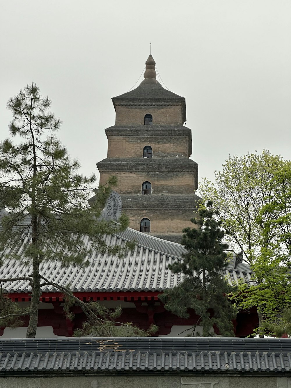 a tall tower with a clock on the top of it