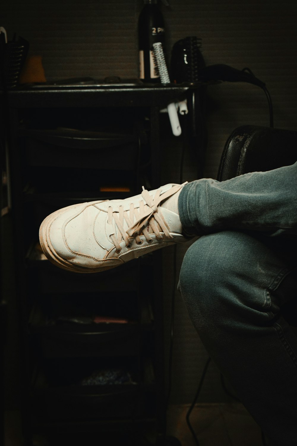 a person sitting on a chair with their feet up