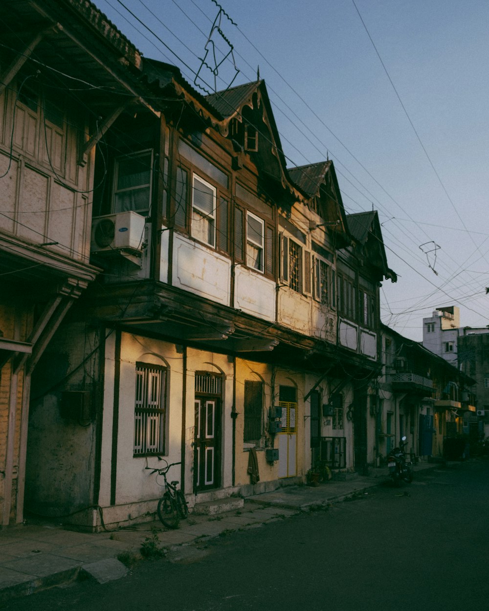 an old building with a bicycle parked in front of it