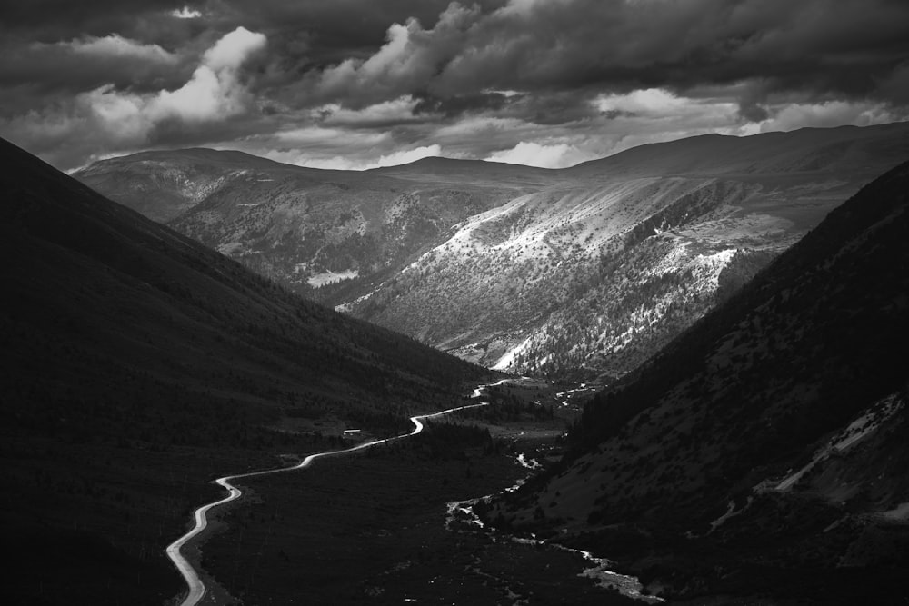 a black and white photo of a mountain range