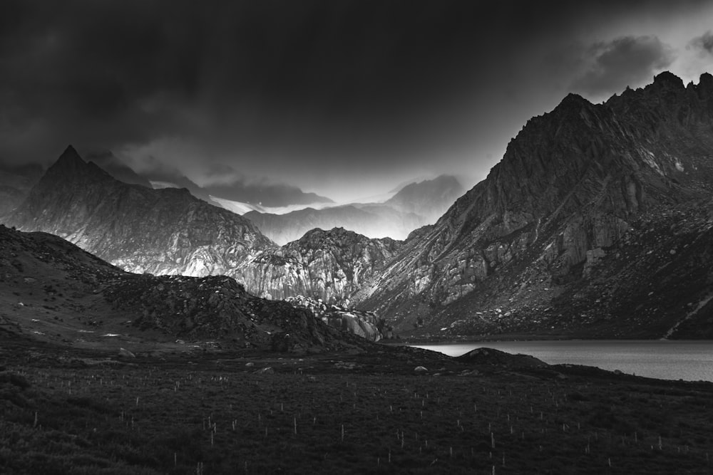 a black and white photo of a mountain range