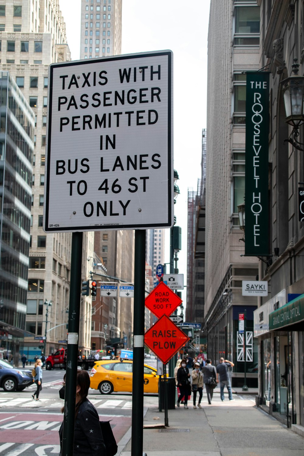 a sign on a pole on a city street