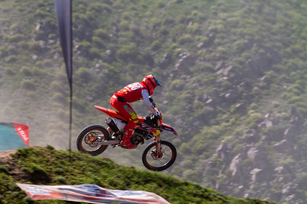 a person on a dirt bike in the air